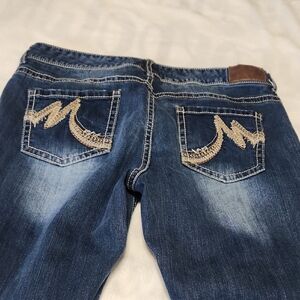 Maurices Dark Blue Boot Cut Jeans with Tan Stitching